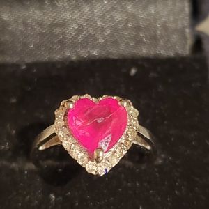 Heart shaped ruby and diamond halo ring